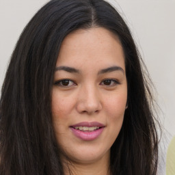 Joyful asian young-adult female with long  brown hair and brown eyes