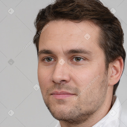 Joyful white adult male with short  brown hair and brown eyes