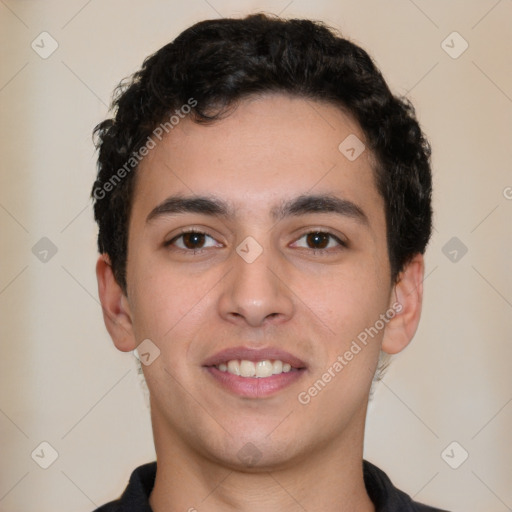 Joyful white young-adult male with short  black hair and brown eyes