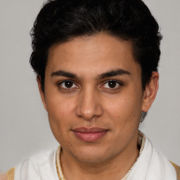 Joyful latino young-adult male with short  brown hair and brown eyes