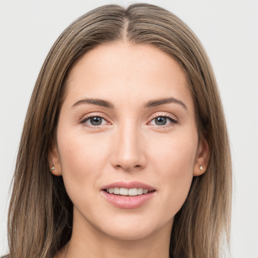 Joyful white young-adult female with long  brown hair and grey eyes