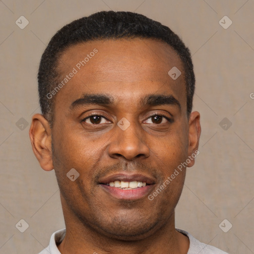 Joyful latino young-adult male with short  black hair and brown eyes