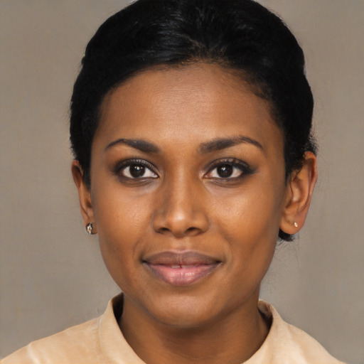 Joyful latino young-adult female with short  black hair and brown eyes