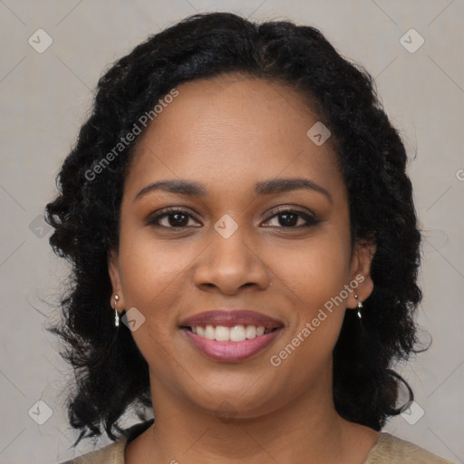 Joyful black young-adult female with long  brown hair and brown eyes