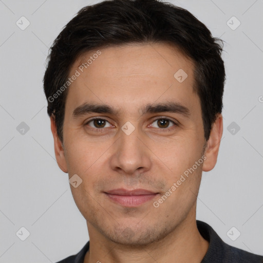 Joyful white young-adult male with short  black hair and brown eyes