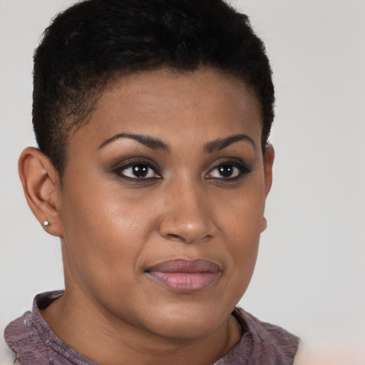 Joyful black young-adult female with short  brown hair and brown eyes