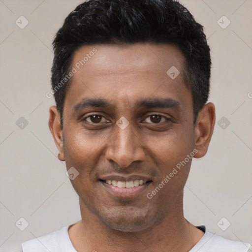 Joyful latino young-adult male with short  black hair and brown eyes