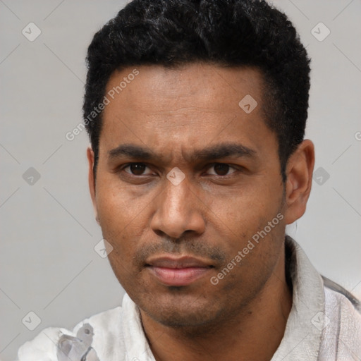 Neutral latino adult male with short  black hair and brown eyes