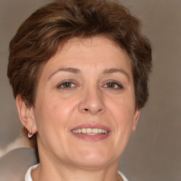 Joyful white adult female with short  brown hair and brown eyes