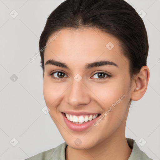 Joyful white young-adult female with short  brown hair and brown eyes