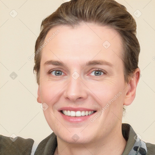 Joyful white young-adult female with short  brown hair and grey eyes