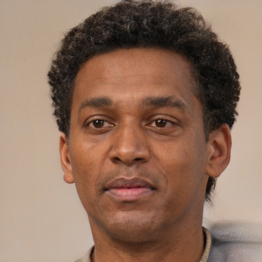 Neutral black adult male with short  brown hair and brown eyes