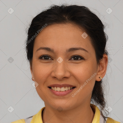 Joyful latino young-adult female with medium  brown hair and brown eyes