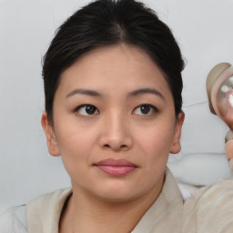 Joyful white young-adult female with medium  brown hair and brown eyes