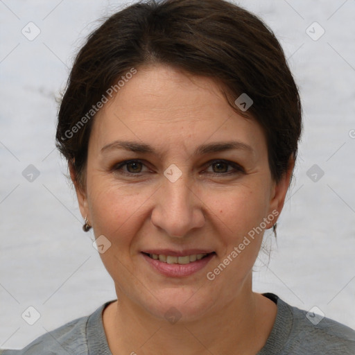 Joyful white adult female with short  brown hair and brown eyes