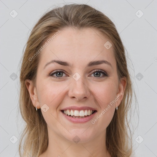 Joyful white young-adult female with medium  brown hair and grey eyes