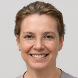 Joyful white adult female with short  brown hair and grey eyes