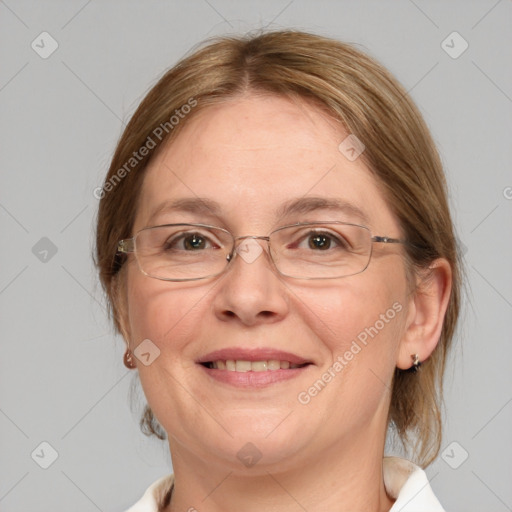 Joyful white adult female with medium  brown hair and grey eyes