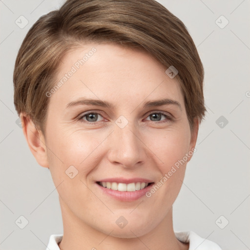 Joyful white young-adult female with short  brown hair and grey eyes