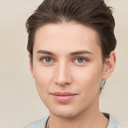 Neutral white young-adult female with short  brown hair and brown eyes