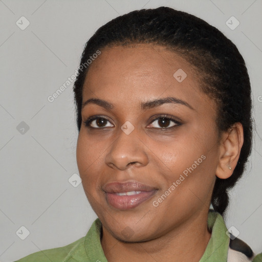 Joyful black young-adult female with medium  black hair and brown eyes