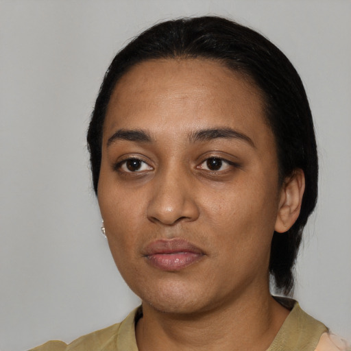 Neutral black young-adult female with medium  black hair and brown eyes