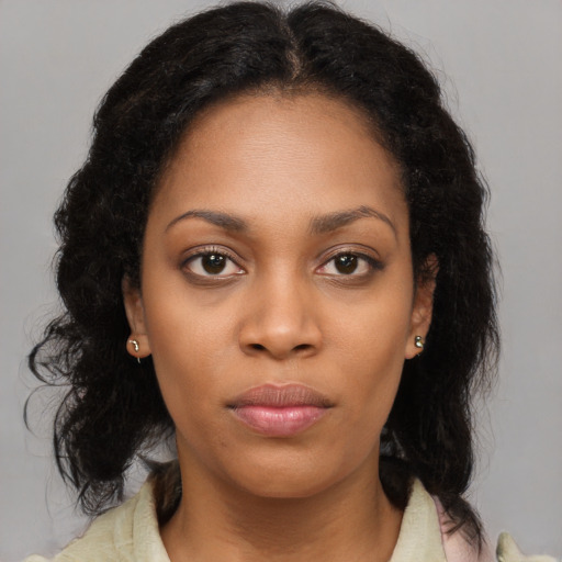 Neutral black young-adult female with long  brown hair and brown eyes