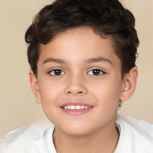 Joyful white child male with short  brown hair and brown eyes