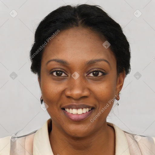 Joyful black young-adult female with short  black hair and brown eyes