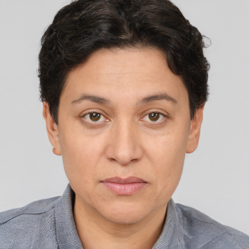 Joyful white adult female with short  brown hair and brown eyes