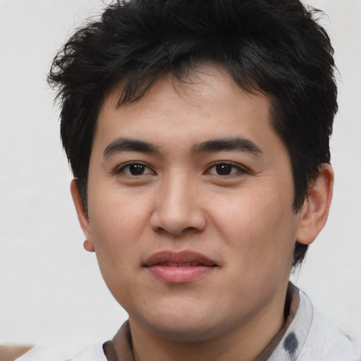 Joyful asian young-adult male with short  brown hair and brown eyes