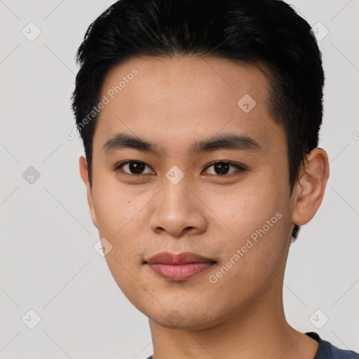 Joyful asian young-adult male with short  black hair and brown eyes