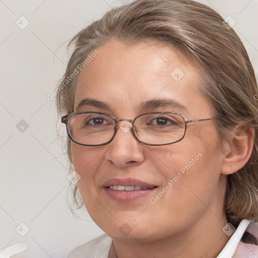 Joyful white adult female with medium  brown hair and blue eyes