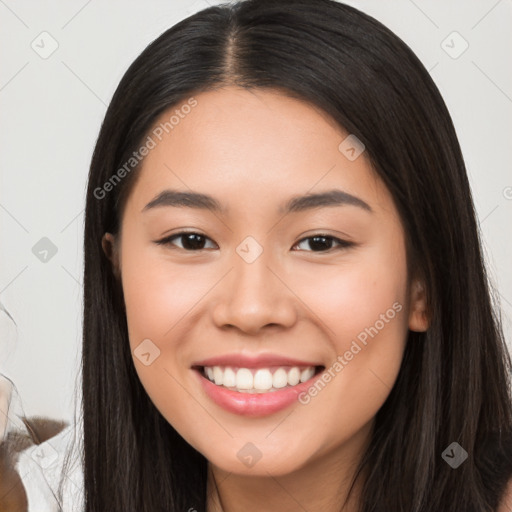 Joyful white young-adult female with long  black hair and brown eyes