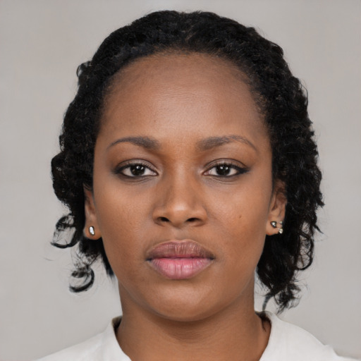 Neutral black young-adult female with medium  black hair and brown eyes