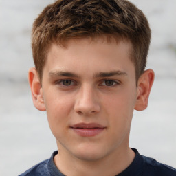 Joyful white child male with short  brown hair and brown eyes