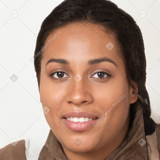 Joyful latino young-adult female with long  brown hair and brown eyes