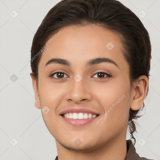 Joyful white young-adult female with short  brown hair and brown eyes