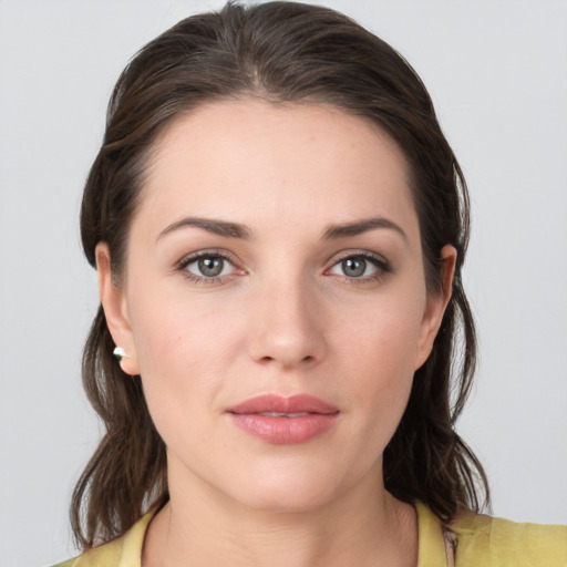 Neutral white young-adult female with medium  brown hair and grey eyes