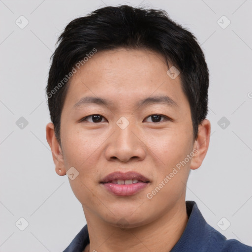 Joyful asian young-adult male with short  black hair and brown eyes