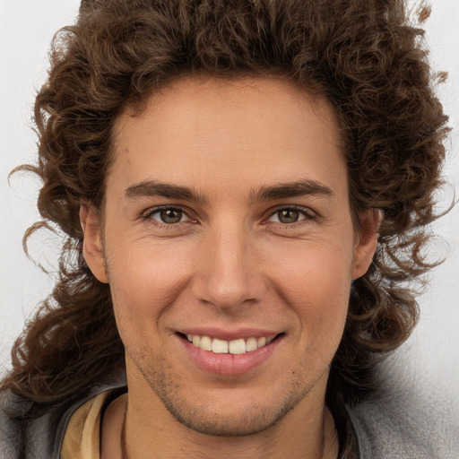 Joyful white young-adult male with medium  brown hair and brown eyes