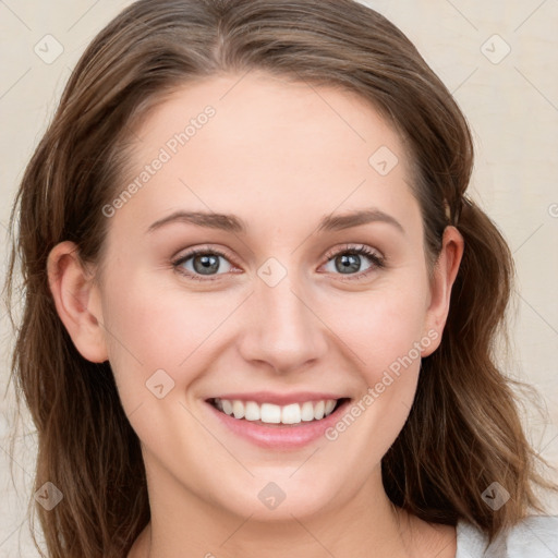 Joyful white young-adult female with medium  brown hair and blue eyes