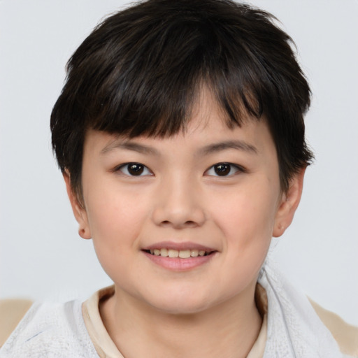 Joyful white child female with short  brown hair and brown eyes
