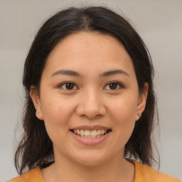 Joyful white young-adult female with medium  brown hair and brown eyes