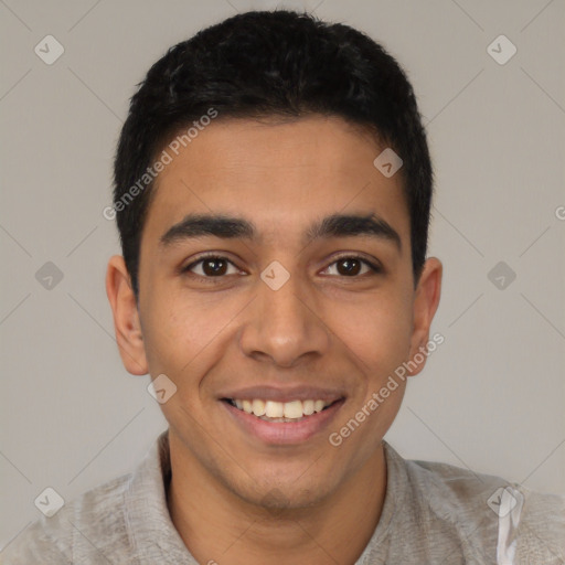 Joyful latino young-adult male with short  brown hair and brown eyes