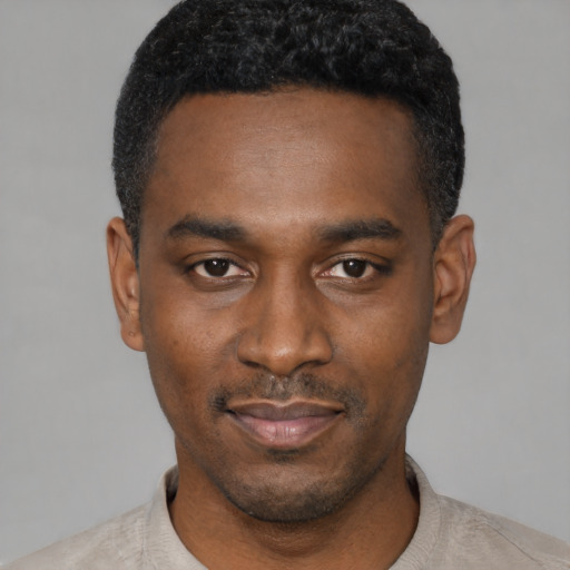 Neutral black young-adult male with short  black hair and brown eyes