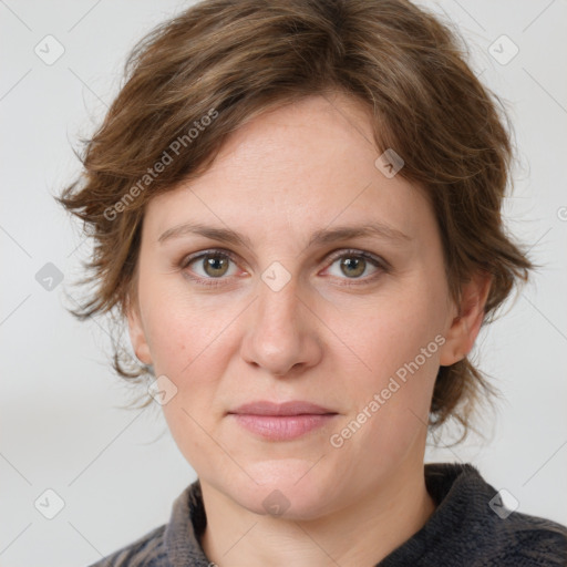 Joyful white adult female with medium  brown hair and green eyes