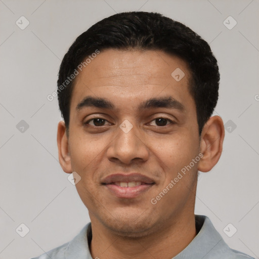 Joyful latino young-adult male with short  black hair and brown eyes