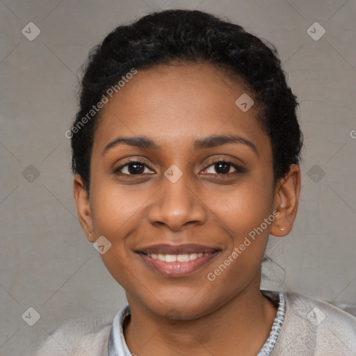 Joyful black young-adult female with short  black hair and brown eyes