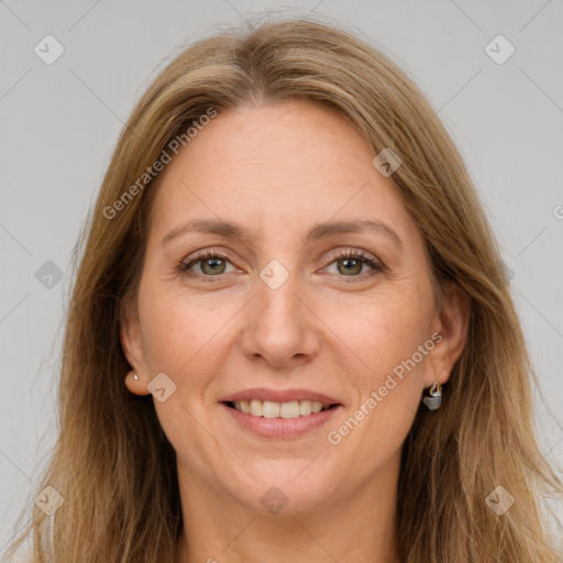 Joyful white adult female with long  brown hair and grey eyes